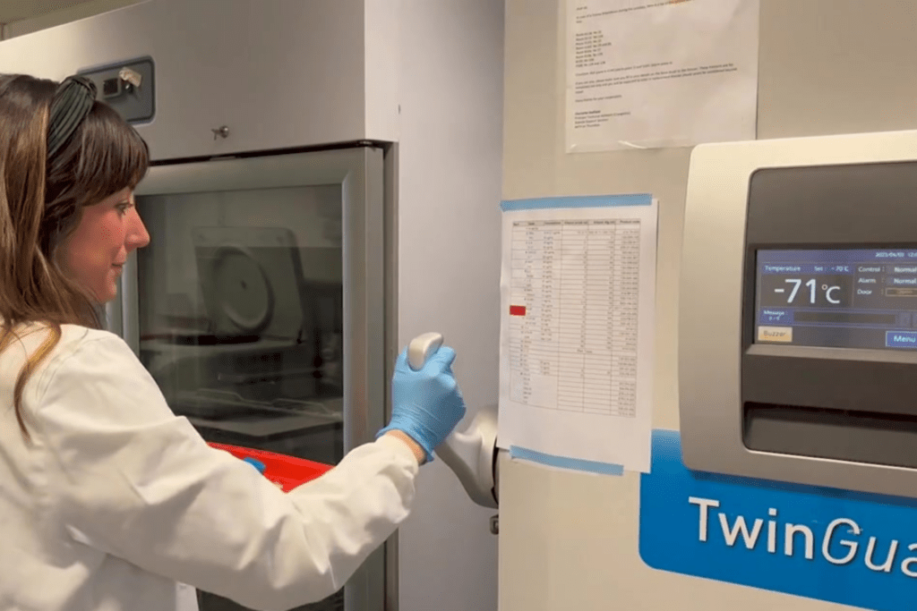 Dr. Roser Vento-Tormo standing in front of a TwinGuard laboratory machine